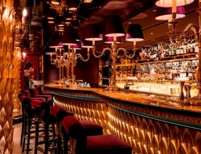 London's glamorous Chinese Bar and restaurant featuring gold and luxury seating in Mayfair