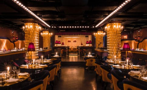 High-end wide view of a golden Chinese restaurant with glamourous seating in Mayfair, London