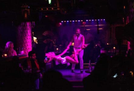 Cabaret dancers in a hedonistic dining setting at Park Chinois, Mayfair, London
