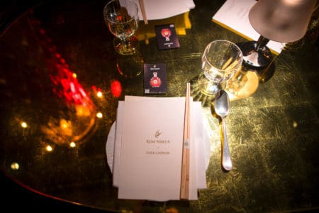 A glamorous chines menu, on a table with chop sticks at Park Chinois in Mayfair.