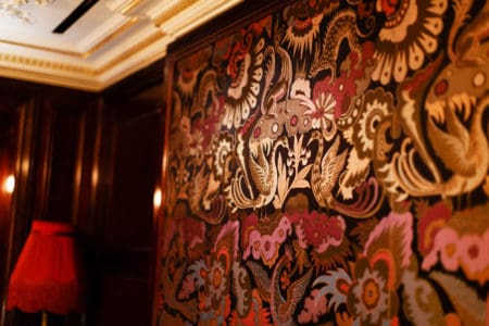 An up-close shot of the upholstered wall art of Park Chinois private dining rooms in Mayfair